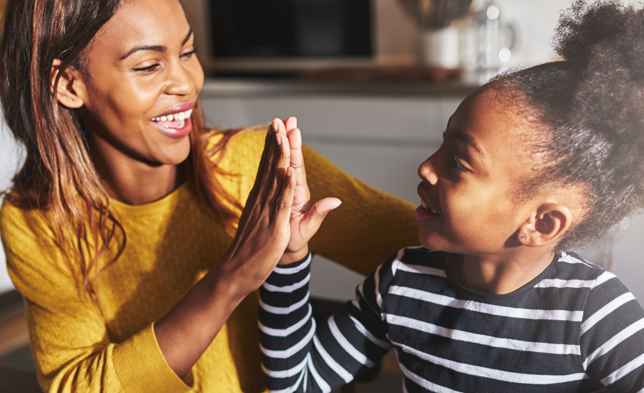 Black Mother and Child High Five